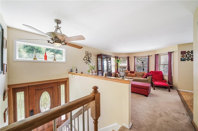 interior space featuring carpet and a healthy amount of sunlight