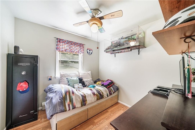 bedroom featuring light wood-type flooring and ceiling fan