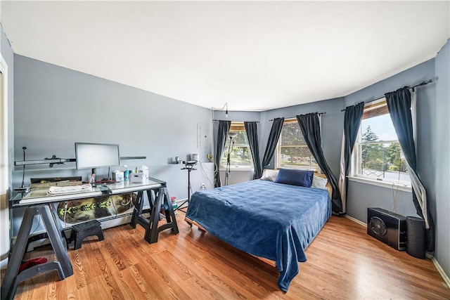 bedroom with hardwood / wood-style flooring