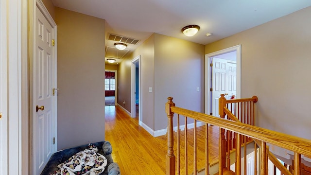 hall with light hardwood / wood-style floors