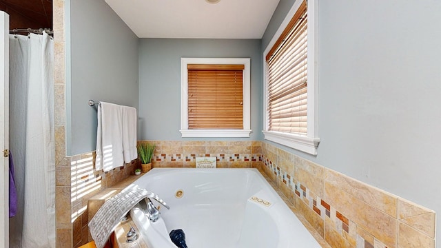 bathroom featuring tiled tub