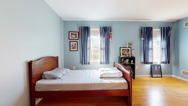 bedroom with light hardwood / wood-style flooring