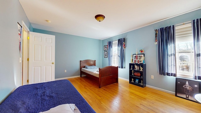 bedroom with light hardwood / wood-style floors