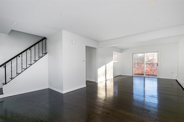 unfurnished room with dark hardwood / wood-style floors