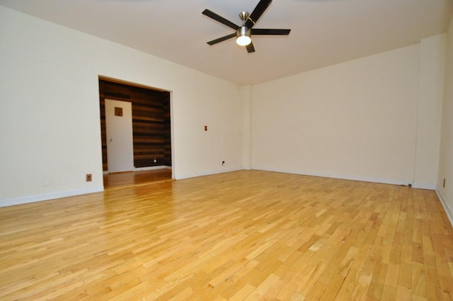 unfurnished room featuring ceiling fan and light hardwood / wood-style floors