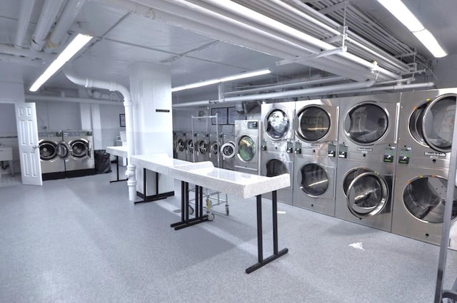 washroom with washer and dryer and stacked washer / dryer