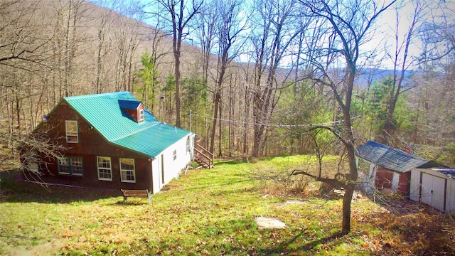 339 Mountain Lake Rd, Andes, NY 13731 - view of property exterior featuring a view of trees, metal roof, a yard, stairs, and an outdoor structure