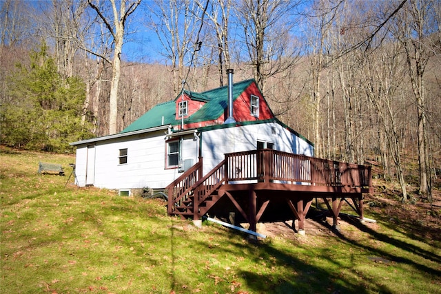 339 Mountain Lake Rd, Andes, NY 13731 - rear view of property featuring a deck, a lawn, metal roof, and a wooded view