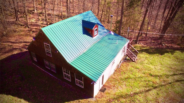 view of property exterior with a yard