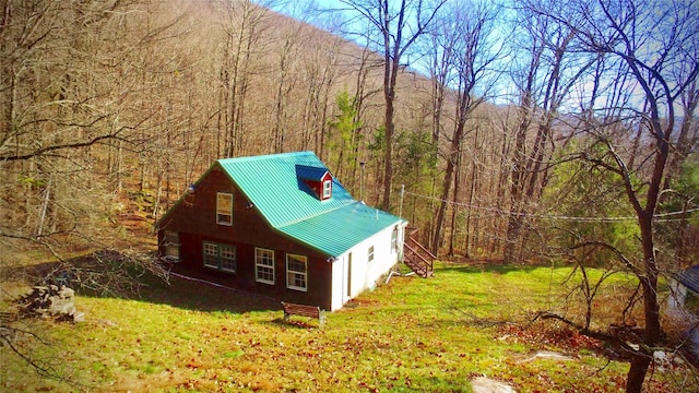 339 Mountain Lake Rd, Andes, NY 13731 - view of side of home with a view of trees, metal roof, and a lawn