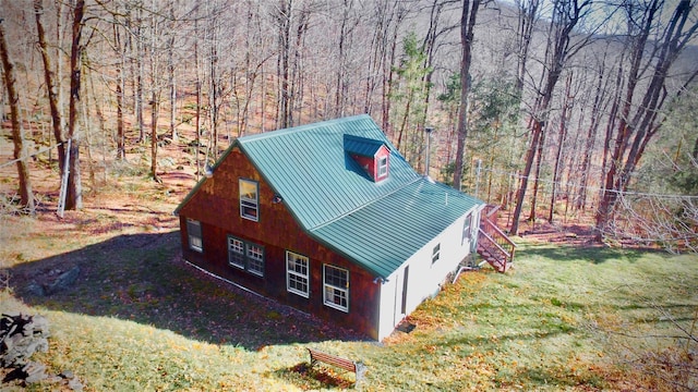 339 Mountain Lake Rd, Andes, NY 13731 - view of home's exterior with a standing seam roof, metal roof, a yard, a view of trees, and stairs