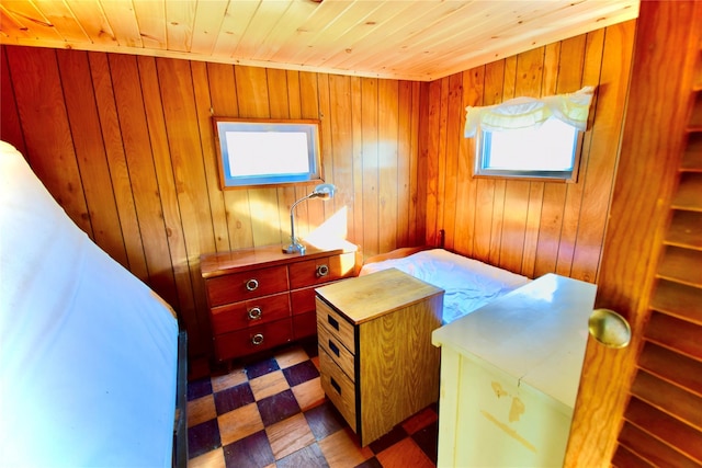 339 Mountain Lake Rd, Andes, NY 13731 - bedroom with wood walls, wood ceiling, and dark flooring
