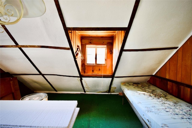 unfurnished bedroom with wooden walls