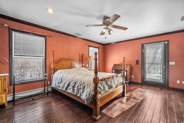 bedroom with a baseboard radiator, wood finished floors, and ornamental molding