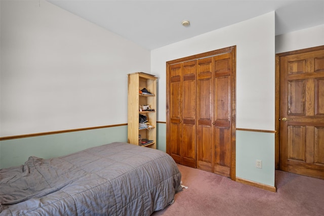 bedroom featuring a closet and carpet floors
