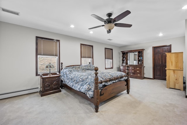 bedroom with visible vents, recessed lighting, light colored carpet, and baseboard heating