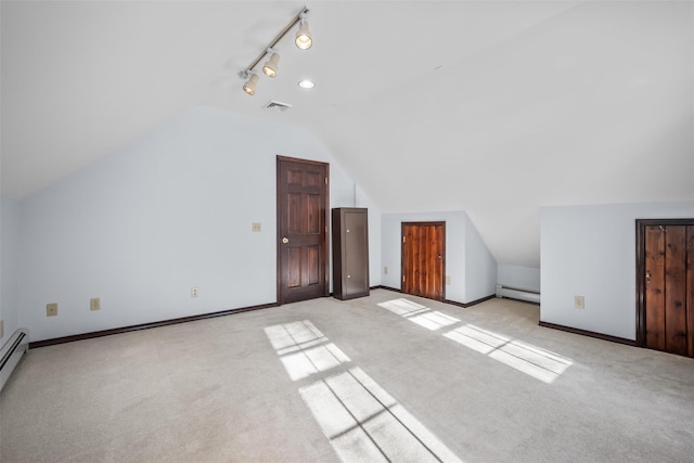 bonus room featuring baseboards, visible vents, lofted ceiling, a baseboard radiator, and light colored carpet