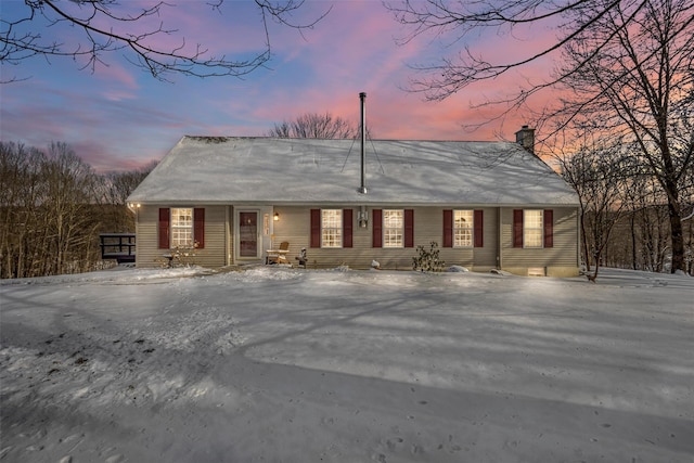 view of front of property featuring a chimney