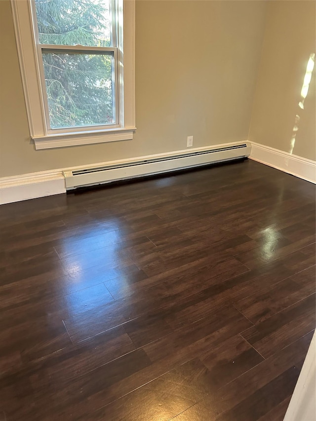 empty room with hardwood / wood-style floors