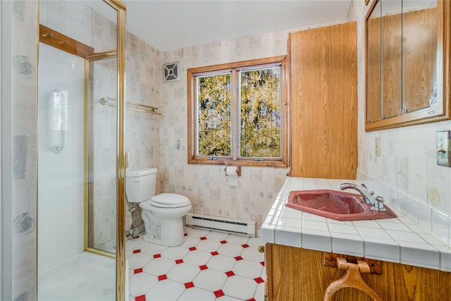 bathroom with toilet, an enclosed shower, baseboard heating, and vanity