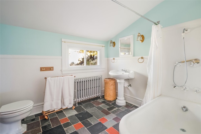 bathroom featuring radiator, shower / tub combo with curtain, lofted ceiling, and toilet