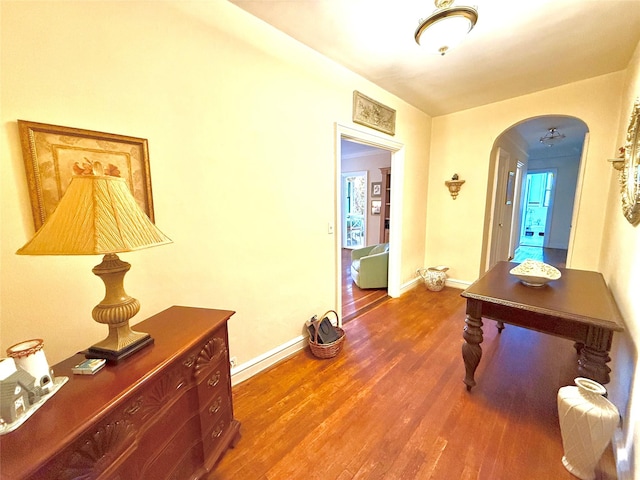 corridor featuring dark hardwood / wood-style flooring