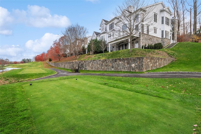 view of home's community featuring a lawn