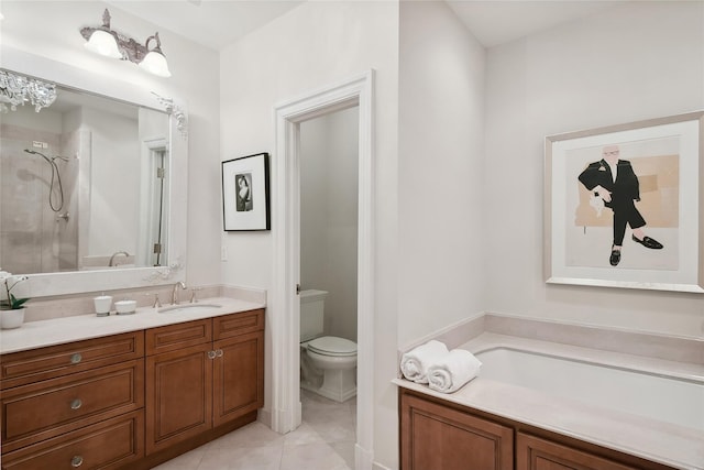 full bathroom featuring tile patterned floors, vanity, shower with separate bathtub, and toilet