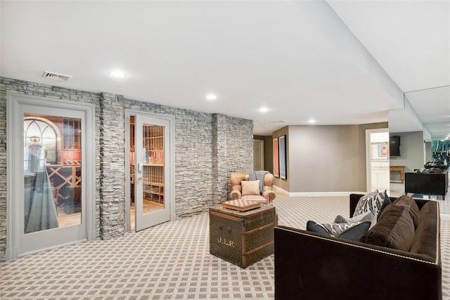 living room featuring light colored carpet and french doors