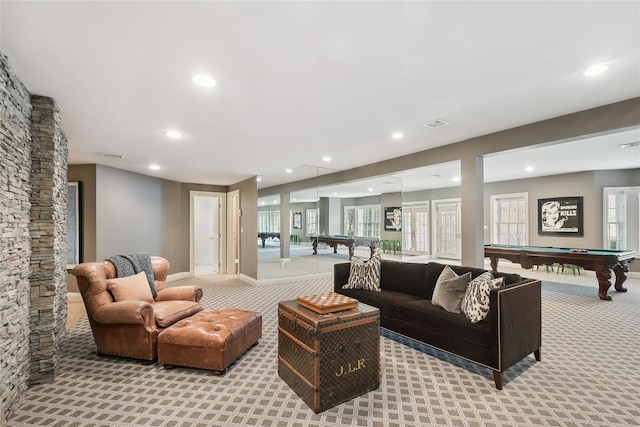 carpeted living room with pool table