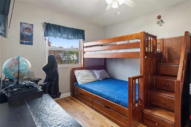 bedroom with ceiling fan and light hardwood / wood-style flooring