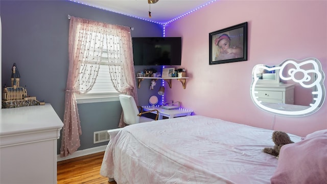 bedroom with light hardwood / wood-style flooring