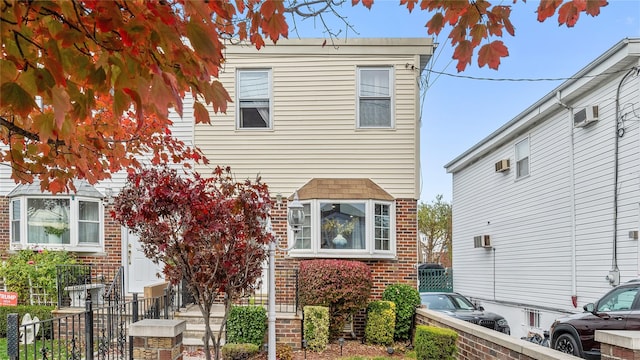 multi unit property featuring a wall mounted AC