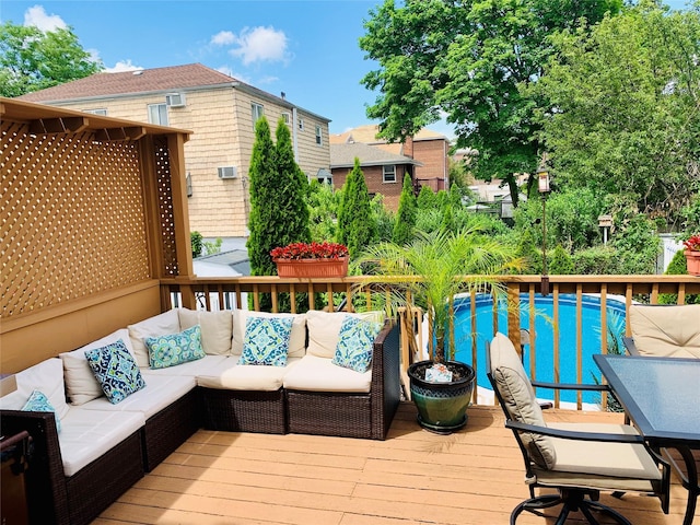 wooden deck with an outdoor living space