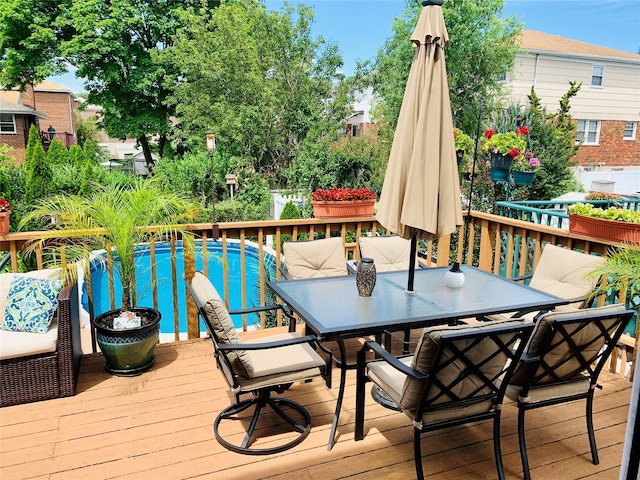 3207 Ampere Ave, Bronx, NY 10465 - deck with outdoor dining area and an outdoor pool
