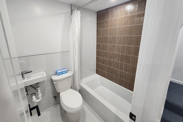 bathroom with shower / bathtub combination with curtain, tile walls, and toilet