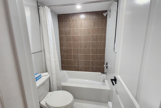 bathroom featuring shower / bath combination with curtain and toilet