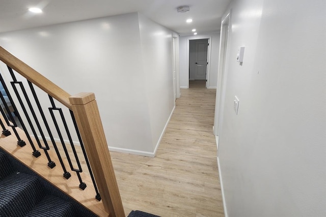 corridor featuring light hardwood / wood-style floors