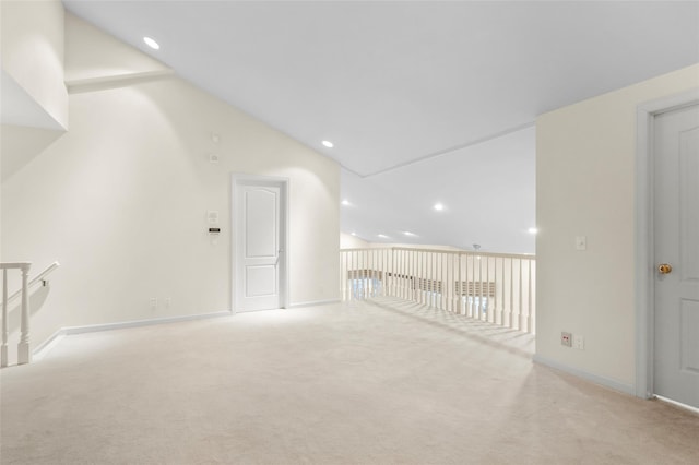 bonus room featuring light carpet and high vaulted ceiling