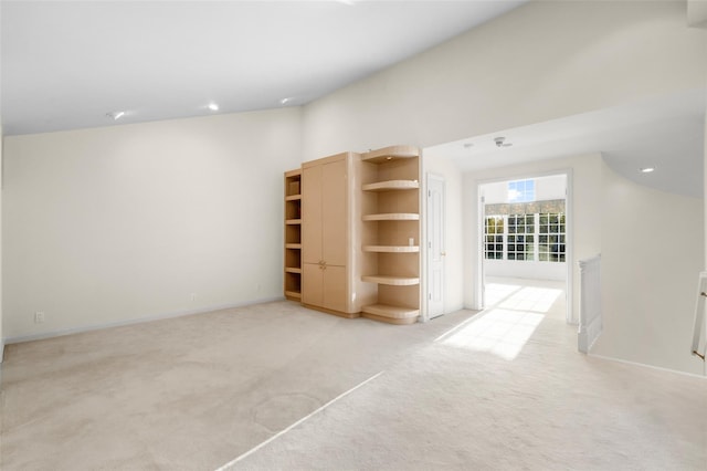 spare room featuring light colored carpet