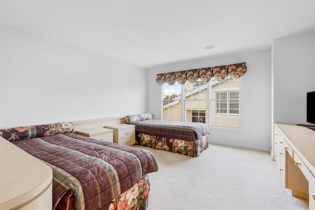 bedroom with light carpet