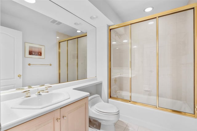 full bathroom with tile patterned flooring, vanity, toilet, and bath / shower combo with glass door