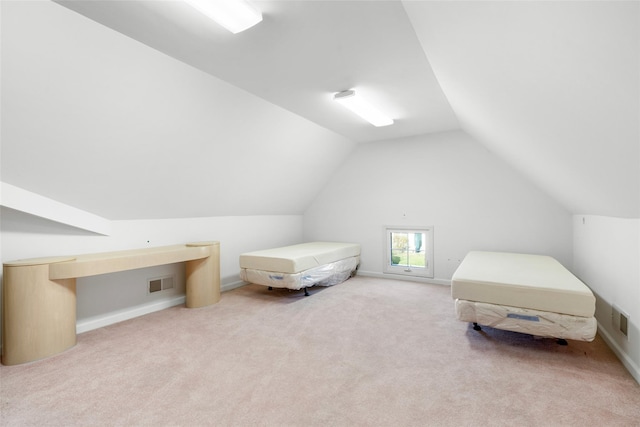 carpeted bedroom with vaulted ceiling