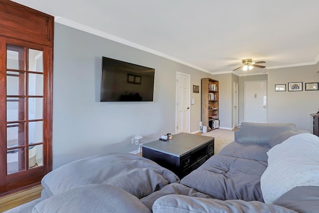 living room featuring hardwood / wood-style flooring, ceiling fan, and ornamental molding