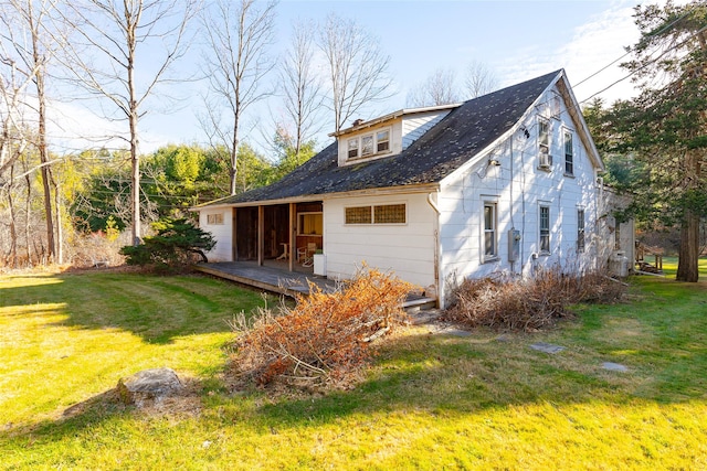 back of house featuring a yard