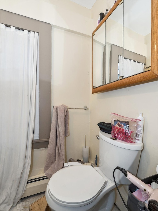 bathroom with toilet and a baseboard heating unit