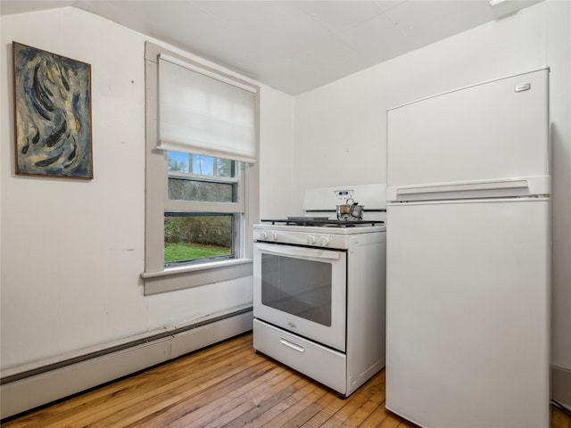 kitchen featuring white appliances, baseboard heating, and light hardwood / wood-style flooring