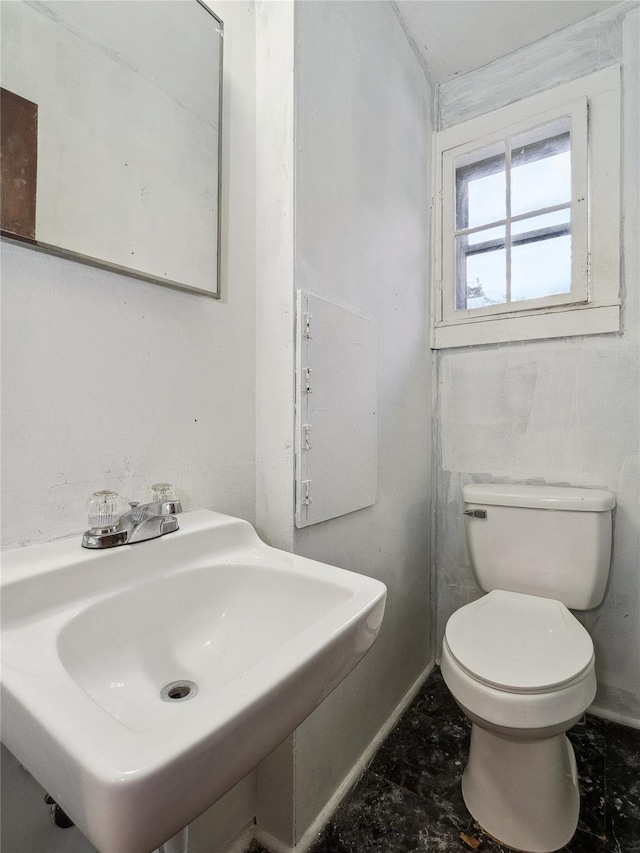 bathroom with toilet and sink