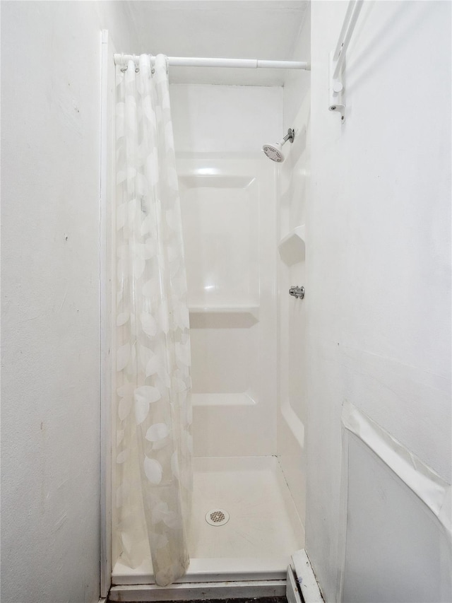 bathroom with a shower with shower curtain