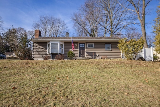 single story home with a front lawn